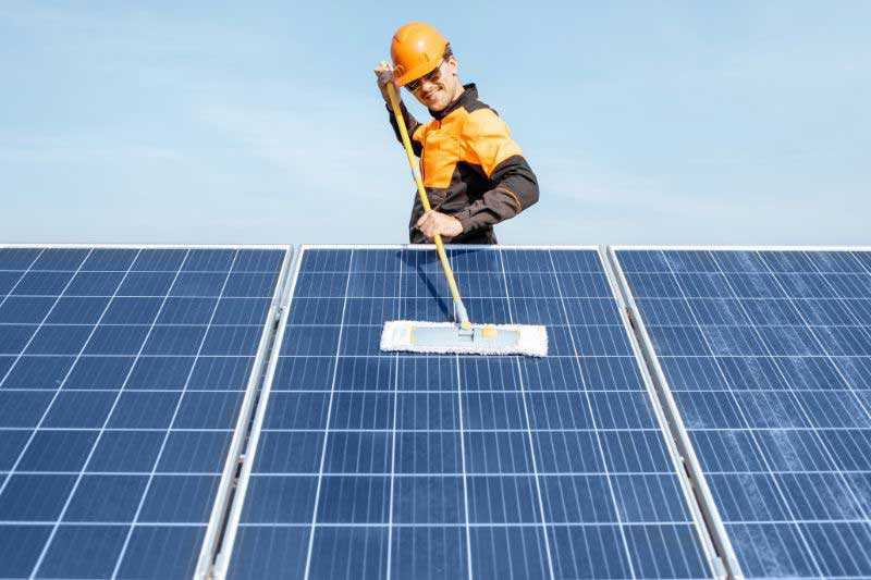 team cleaning solar panels in the Whitsundays 
